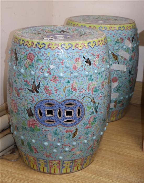 A pair of 19th century Chinese famille rose enamelled garden seats (a.f.)